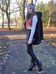 she wears quite a bit of<br />black disco slacks