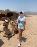 a tight shorts outfit and a camel together in the same picture; very very unusual but this gal visitd sharm el-sheikh in egypt during the corona virus pandemic>>>>>LOL<br />women have to wear some sort of head veil as well in arabic countries....making for a very very unusual@interesting pic; for the locals over there to ask them their views to seeing this 'spectacle'<br />the head veil + mask + glasses; is she in a witness protection program???<br />except she stands out like a sore thumb over there.....HAHAHA